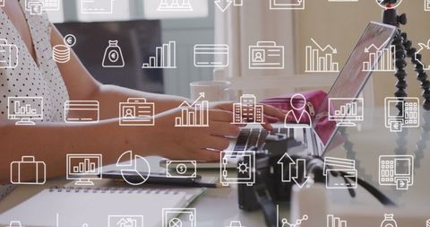 Businesswoman Analyzing Data with Financial Icons Overlay