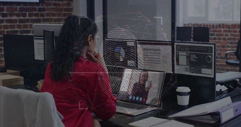 Professional Engaged in Virtual Meeting in Modern Office Setting