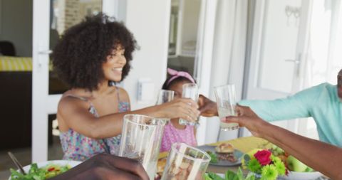 African American Family Enjoying Outdoor Meal Time