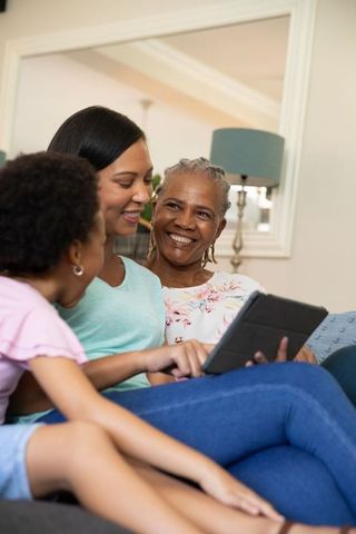 Multigenerational family using tablet together at home