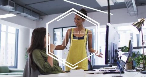 Creative team discussing at modern office desk
