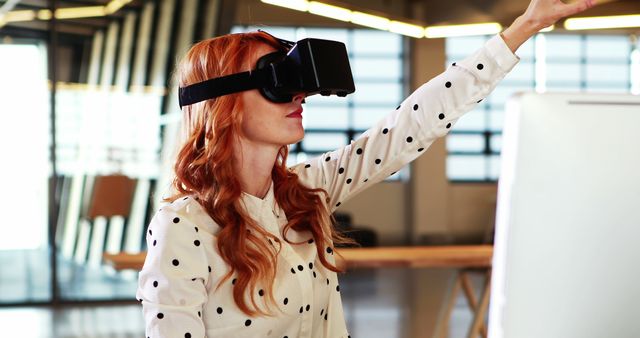 Redhead Woman Using Virtual Reality Headset in Modern Office - Download Free Stock Images Pikwizard.com