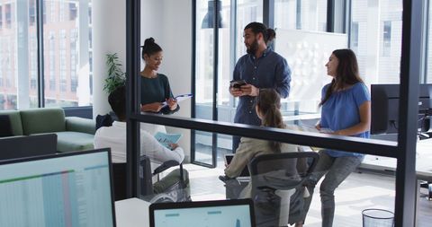 Diverse Team Engaging in Casual Office Meeting - Download Free Stock Images Pikwizard.com