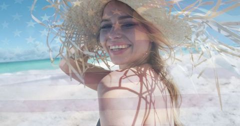 Carefree Woman Enjoying Summer Beach Vacation in Sun Hat