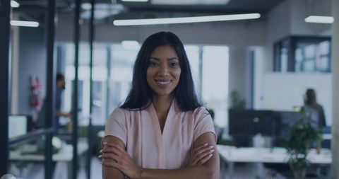 Confident businesswoman in modern open office