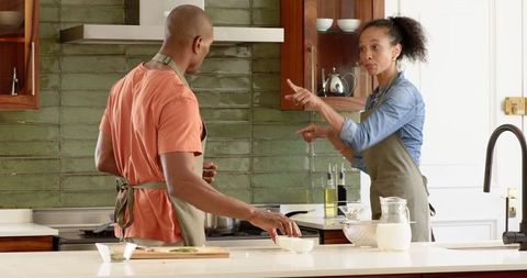 Couple Cooking Together Sharing Fresh Ingredients in Modern Kitchen