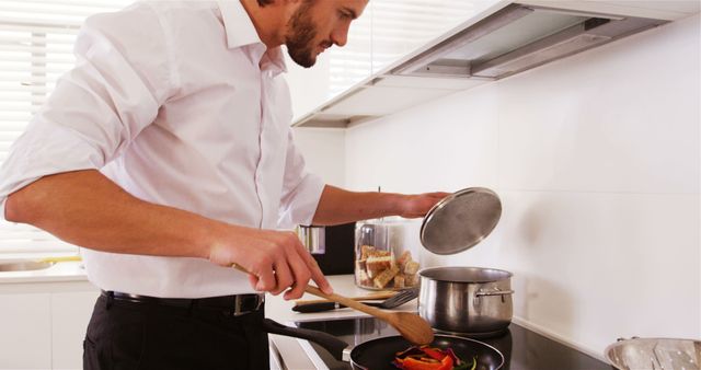 Chef preparing meal with vegetables in modern kitchen - Download Free Stock Images Pikwizard.com