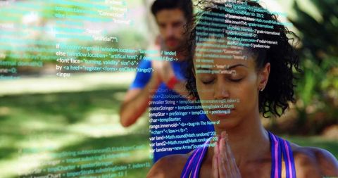 Meditating woman practicing mindfulness outdoors with code overlay and fitness focus