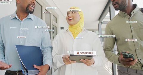 Diverse Business Professionals Discussing Digital Data Interface