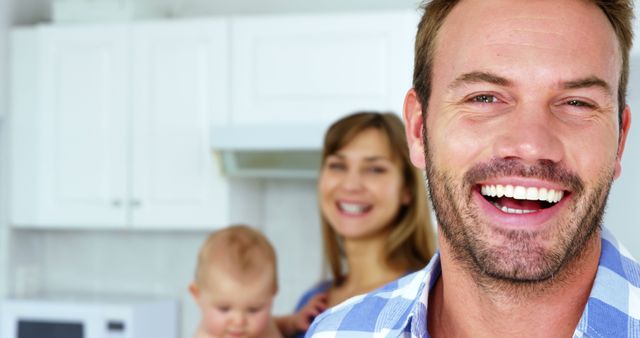 Smiling Father with Family in Kitchen - Download Free Stock Images Pikwizard.com