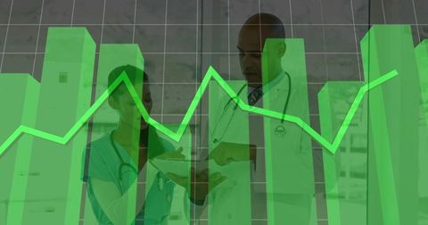 Medical professionals analyzing data tablet in hospital