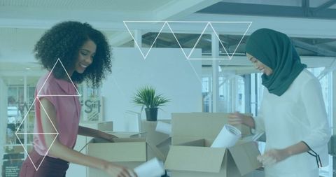 Two Diverse Coworkers Collaborating in Modern Office Environment