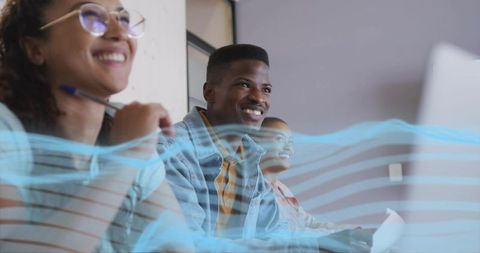 Diverse Professionals Engaged in Corporate Training with Technology