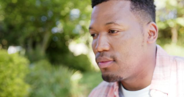 Thoughtful Man Relaxing in Peaceful Garden Setting - Download Free Stock Images Pikwizard.com