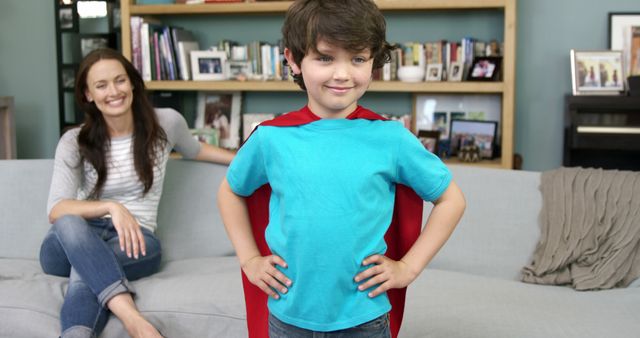 Little Boy Pretending to Be Superhero with Red Cape in Living Room - Download Free Stock Images Pikwizard.com