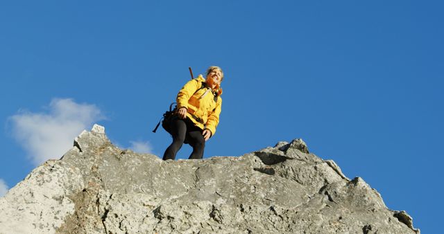Caucasian woman reaches a mountain summit, with copy space - Download Free Stock Photos Pikwizard.com