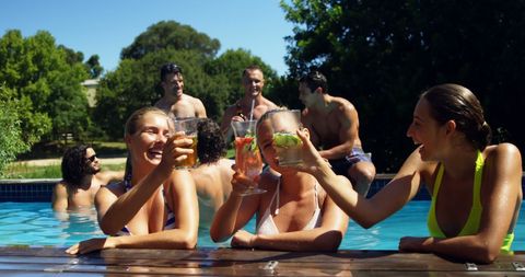 Friends Celebrating Summer by Poolside with Refreshing Drinks - Download Free Stock Images Pikwizard.com