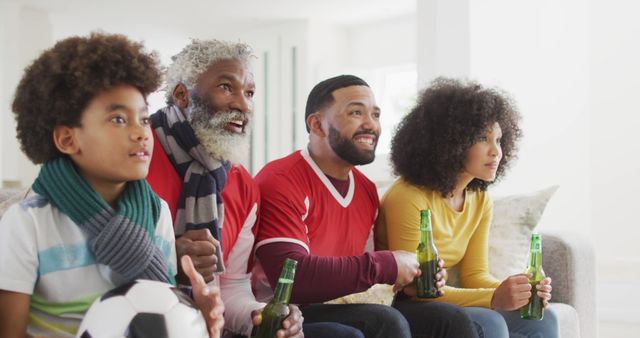 Multi-generational family cheering for soccer team on TV - Download Free Stock Images Pikwizard.com