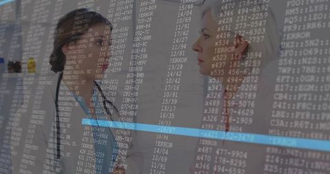 Doctors Discussing in Hospital Hallway with Digital Code Overlay