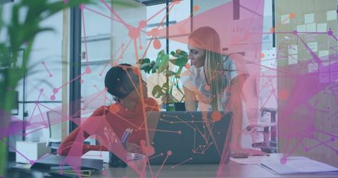 Collaborating Colleagues Discussing Project with Digital Network Overlay