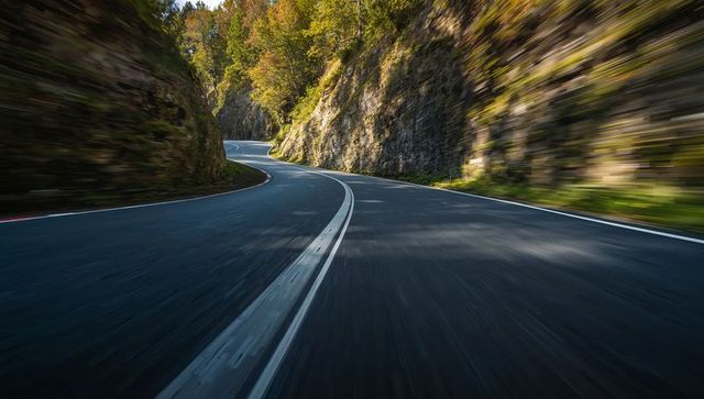 Winding Mountain Road with Autumn Foliage
