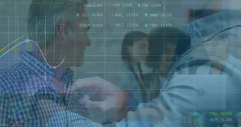 Celebratory Fist Bump Amid Business Success with Financial Charts