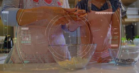 Mother and daughter cracking egg over glass bowl during baking lesson with HUD overlay