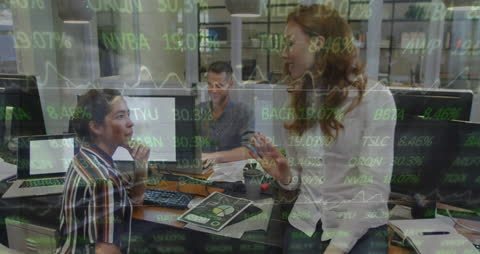 Business Team Celebrating Success with Financial Data Analysis Overlay