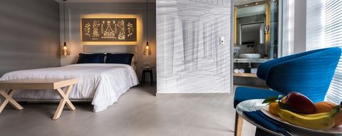 Modern hotel suite design with luxurious decor and fresh fruit