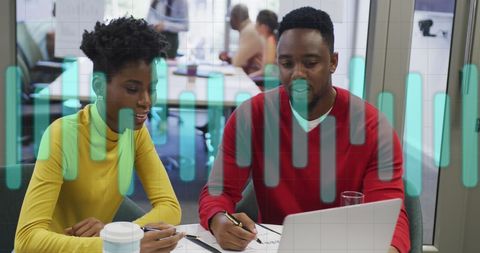 Diverse Business Team Analyzing Data with Digital Elements