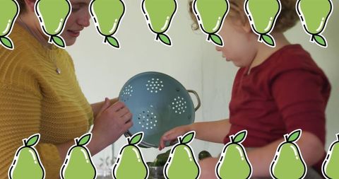 Mother and Son Cooking Together in Home Kitchen
