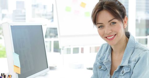 Creative Designer Smiling Confidently in Modern Office - Download Free Stock Images Pikwizard.com