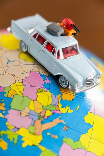 Conceptual image of miniature car on a map