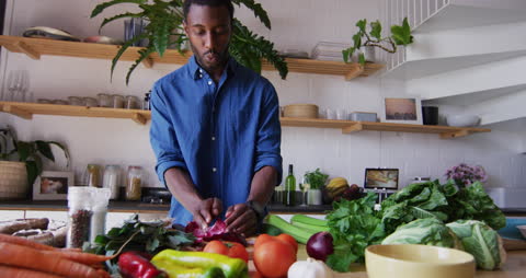 Portrait of Man Preparing Fresh Vegetables in Modern Kitchen