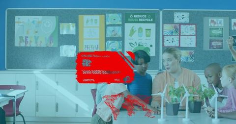 Teacher guiding primary students in hands-on stem sustainability lesson with wind turbines