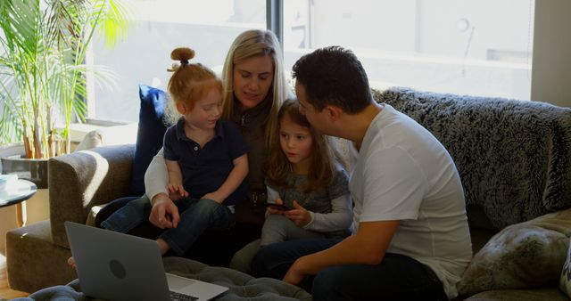 Parents and Children Using Digital Devices in Living Room - Download Free Stock Images Pikwizard.com