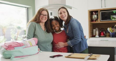 Happy Family Embracing in Modern Kitchen
