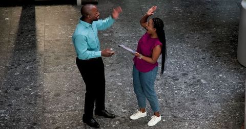 Colleagues Engaging in Business Planning with Tablet in Office