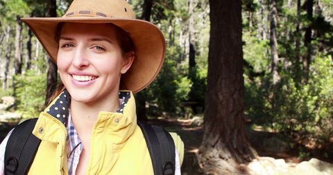 Young Woman Smiling While Hiking in Forest Adventure - Download Free Stock Images Pikwizard.com