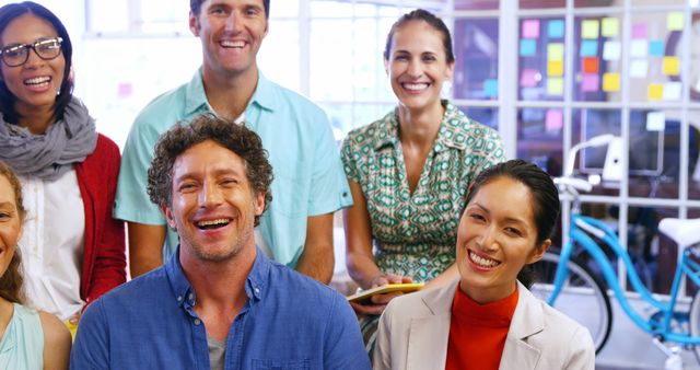 Diverse Group of Colleagues Smiling in Office Environment - Download Free Stock Images Pikwizard.com