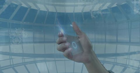 Futuristic hand interacting with transparent holographic phone interface in glass dome