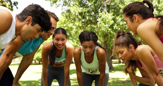 Group of Runners Resting Outdoors During Race in Park - Download Free Stock Images Pikwizard.com