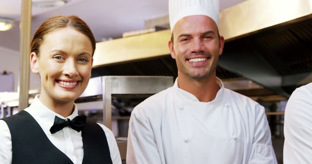 Smiling Chef and Waitress in Professional Kitchen - Download Free Stock Images Pikwizard.com