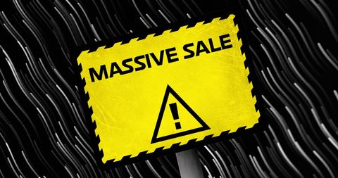 Massive sale sign on blackboard background