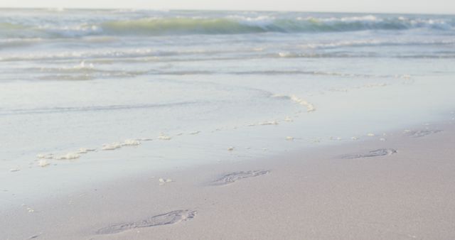 Image of calm sea waves and sand beach - Download Free Stock Photos Pikwizard.com