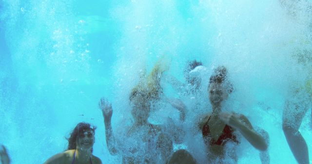 Group of Friends Splashing Underwater in a Pool - Download Free Stock Images Pikwizard.com