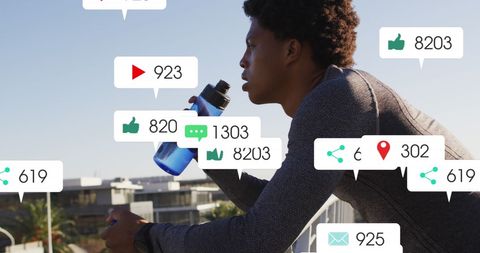 African American Athlete Engaging with Social Media Integrations Outdoors