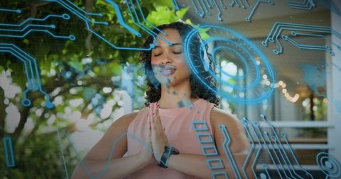 Meditating woman wearing headphones and smartwatch with augmented reality HUD overlay