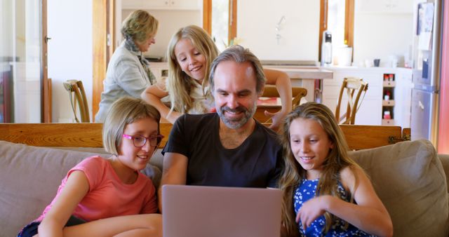 Happy Family Using Laptop at Home in Living Room - Download Free Stock Images Pikwizard.com