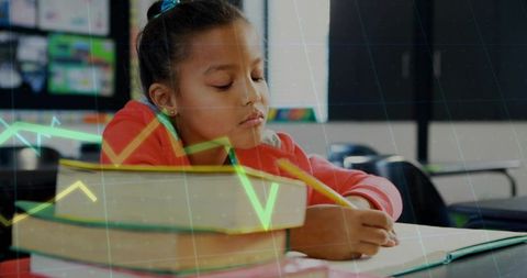 Writing schoolgirl studying with textbooks and notebook in classroom with chart overlay